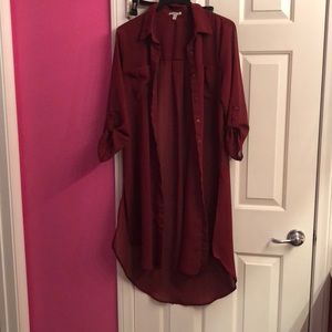 This is a long sleeve burgundy shirt dress.